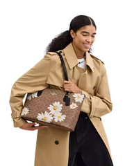 on-model-Coach-Gallery-Tote-Bag-In-Signature-Canvas-With-Floral-Print-Tan-Multi