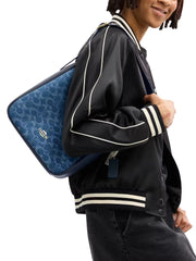 on-model-Coach-Hadley-Convertible-Crossbody-Bag-In-Signature-Denim-Indigo