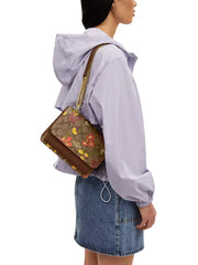 on-model-Coach-Klare-Crossbody-Bag-In-Signature-Canvas-With-Floral-Print-Khaki-Multi