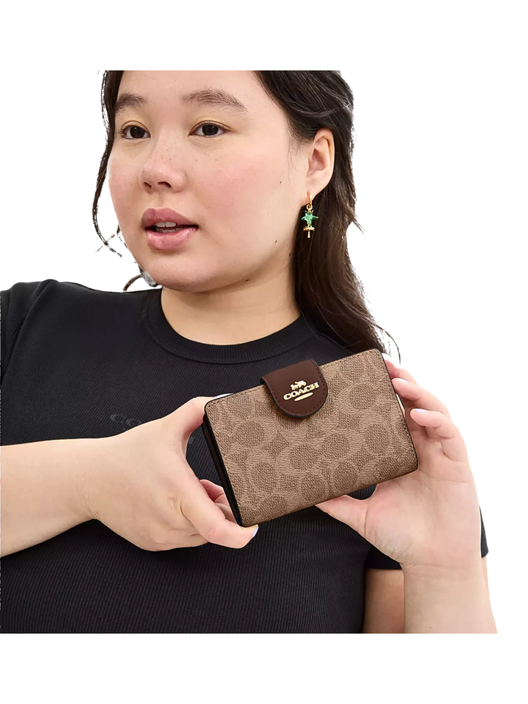 on-model-Coach-Medium-Corner-Zip-Wallet-In-Signature-Canvas-Tan-Brown