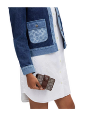 on-model-Coach-Medium-Corner-Zip-Wallet-In-Signature-Jacquard-OakMaple