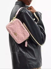 on-model-Coach-Mini-Carey-Crossbody-Bag-In-Signature-Denim-Light-Pink