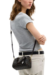 on-model-Coach-Mini-Rowan-Crossbody-Bag-In-Loved-Signature-Canvas-With-Charms-Brown