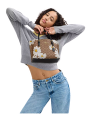 on-model-Coach-Mollie-Tote-Bag-25-In-Signature-Canvas-With-FloraL-Print-Tan-Multi