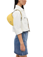 on-model-Coach-Payton-Mini-Pebbled-Leather-Daisy-balilene