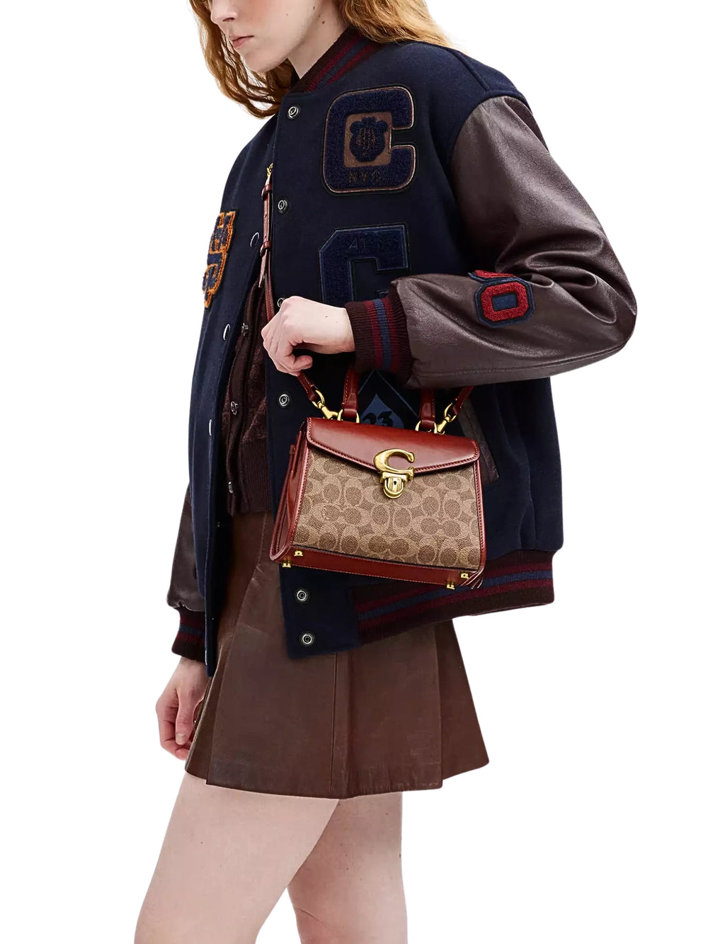 on-model-Coach-Sammy-Top-Handle-21-In-Signature-Canvas-Tan-Rust