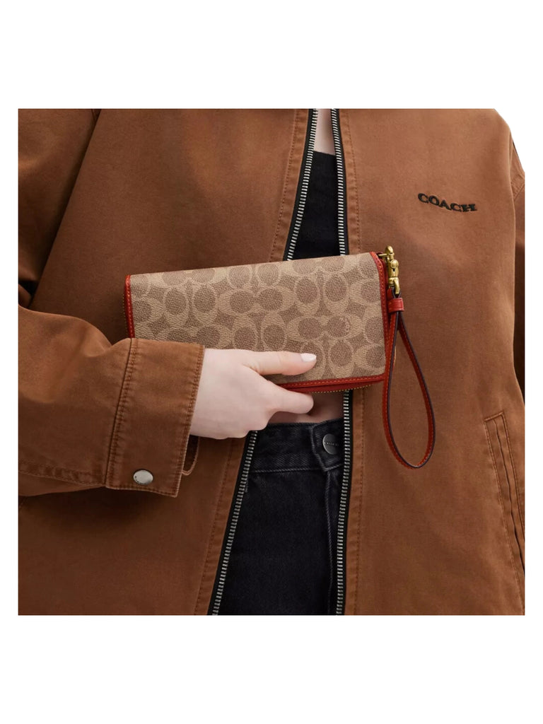 on-model-Coach-Signature-Continental-Wallet-Tan-Rust