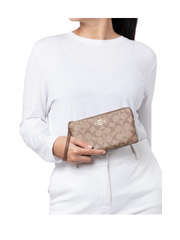 on-model-Coach-Signature-Large-Corner-Zip-Khaki-Saddle