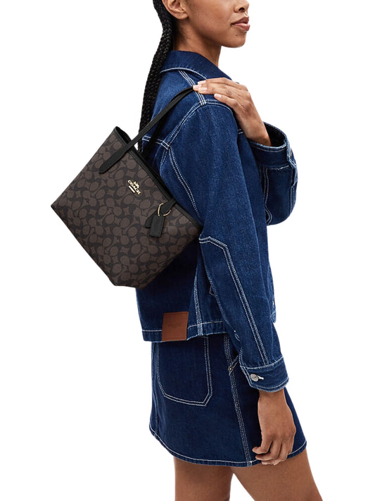on-model-Coach-Small-City-Tote-Bag-In-Signature-Canvas-Walnut-Black
