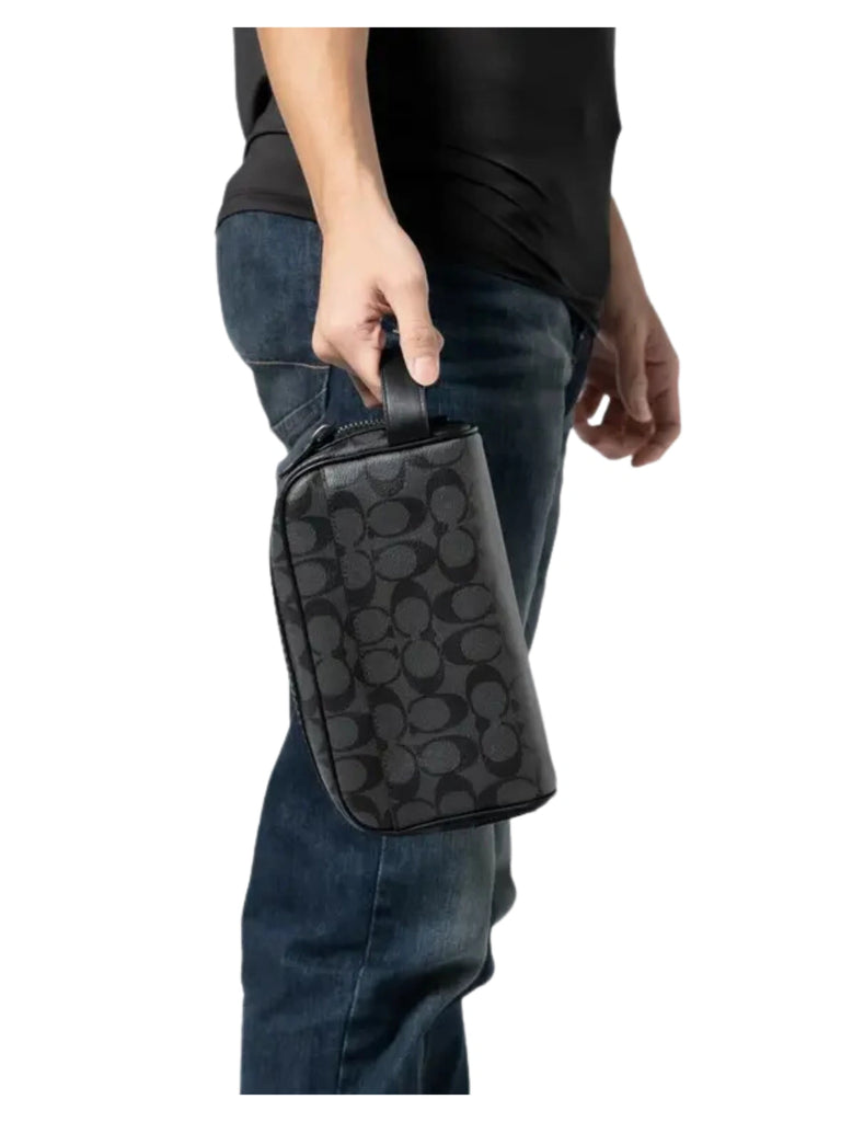 on-model-Coach-Small-Travel-Kit-In-Signature-Canvas-Charcoal-Black