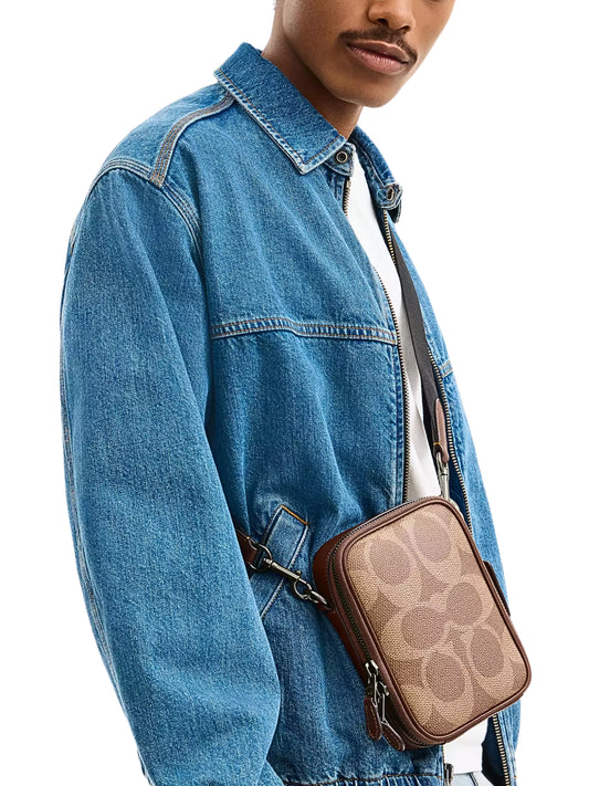 on-model-Coach-Stanton-Crossbody-Bag-In-Signature-Canvas-Tan-Vintage-Brown