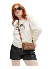 on-model-Coach-Tabby-20-Shoulder-Bag-in-Signature-Patent-Leather-Cappuccino