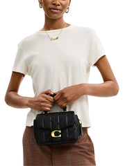 on-model-Coach-Tabby-Top-Handle-Bag-With-Quilting-Black