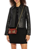on-model-Coach-Tabby-Wristlet-In-Signature-Canvas-Tan-Rust