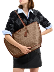 on-model-Coach-Taxi-Tote-Bag-In-Signature-Canvas-Tan-Sable