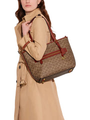 on-model-Coach-Taylor-Tote-In-Signature-Canvas-Tan-Rust