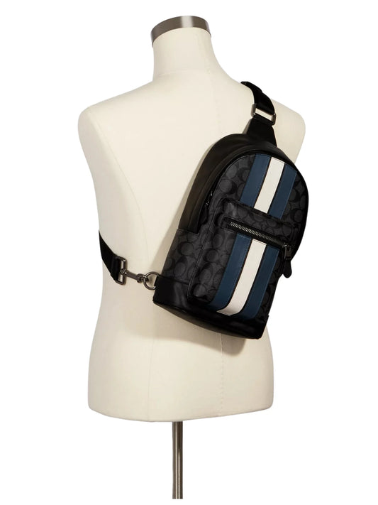 on-model-Coach-West-Pack-In-Signature-Canvas-Varsity-Stripe-Charcoal-Denim-Chalk