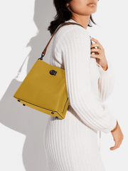 on-model-Coach-Willow-Bucket-Bag-In-Colorblock-Flax-Multi