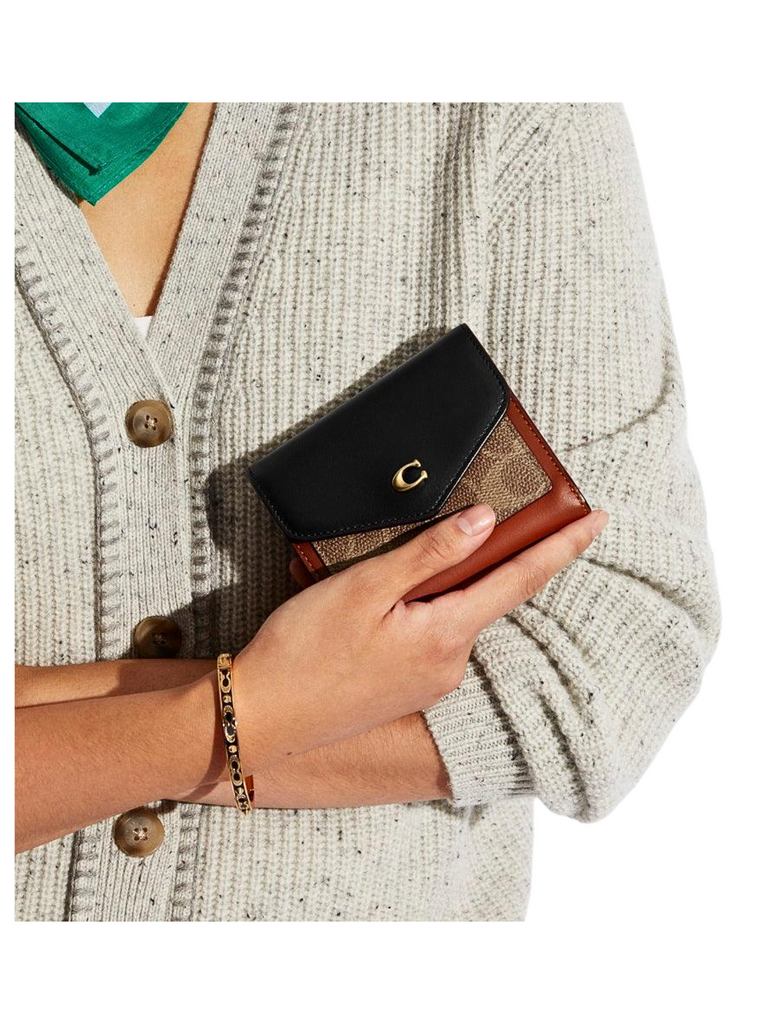 on-model-Coach-Wyn-Small-Wallet-In-Colorblock-Signature-Canvas-Tan-Black