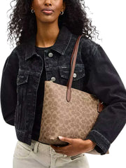 on-model-Coach-Zip-Top-Tote-In-Signature-Canvas-Tan-Brown