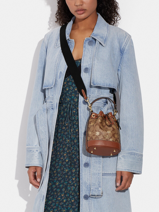 on-model-Coach- Dempsey-Drawstring- Bucket -Bag -15 -In- Signature -Canvas -With- Snowflake Print -Khaki -Multi