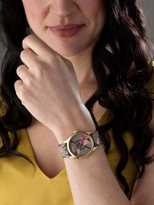 on-model-Gucci-G-Timeless-Floral-Brown-Gold-Leather-Strap-Watch