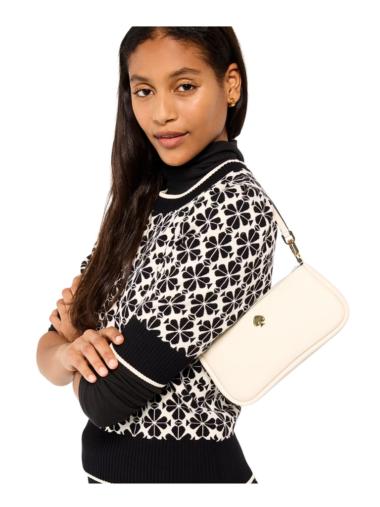 on-model-Kate-Spade-Kayla-Pebbled-Leather-Convertible-Wristlet-Meringue