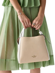 on-model-Kate-Spade-Knott-Carryall-Colorblocked-Medium-Crossbody-Bag-Light-Cream-Multi
