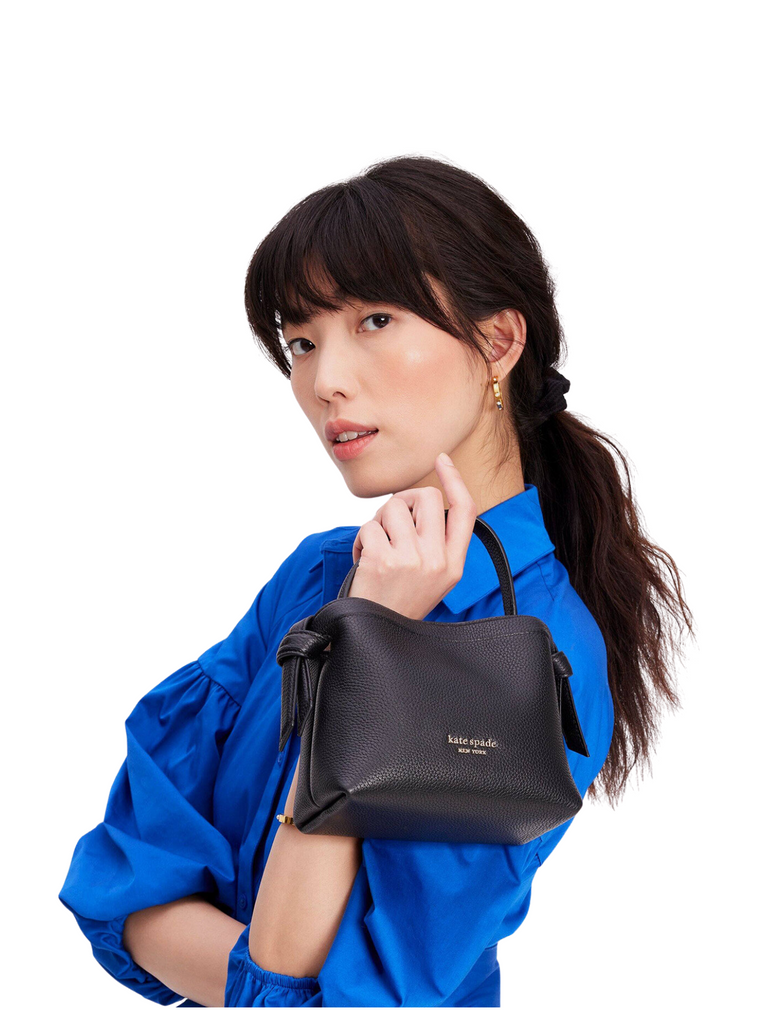 on-model-Kate-Spade-Knott-Mini-Crossbody-Pebbled-Leather-Black