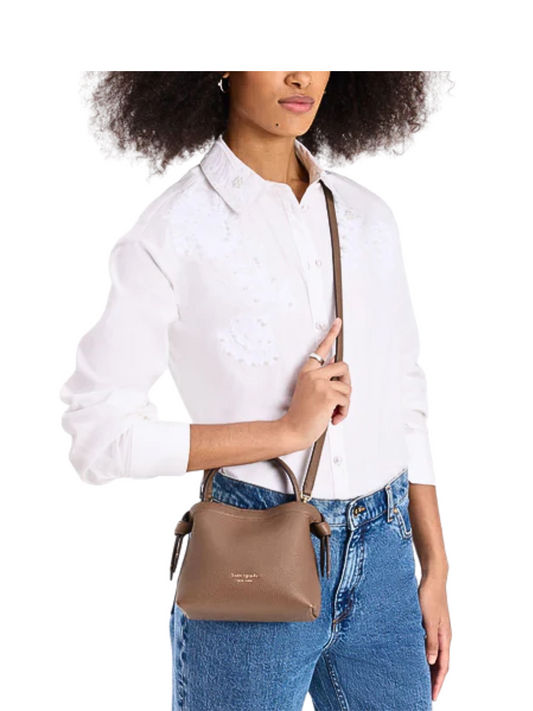 on-model-Kate-Spade-Knott-Mini-Crossbody-Pebbled-Leather-Warm-Accorn