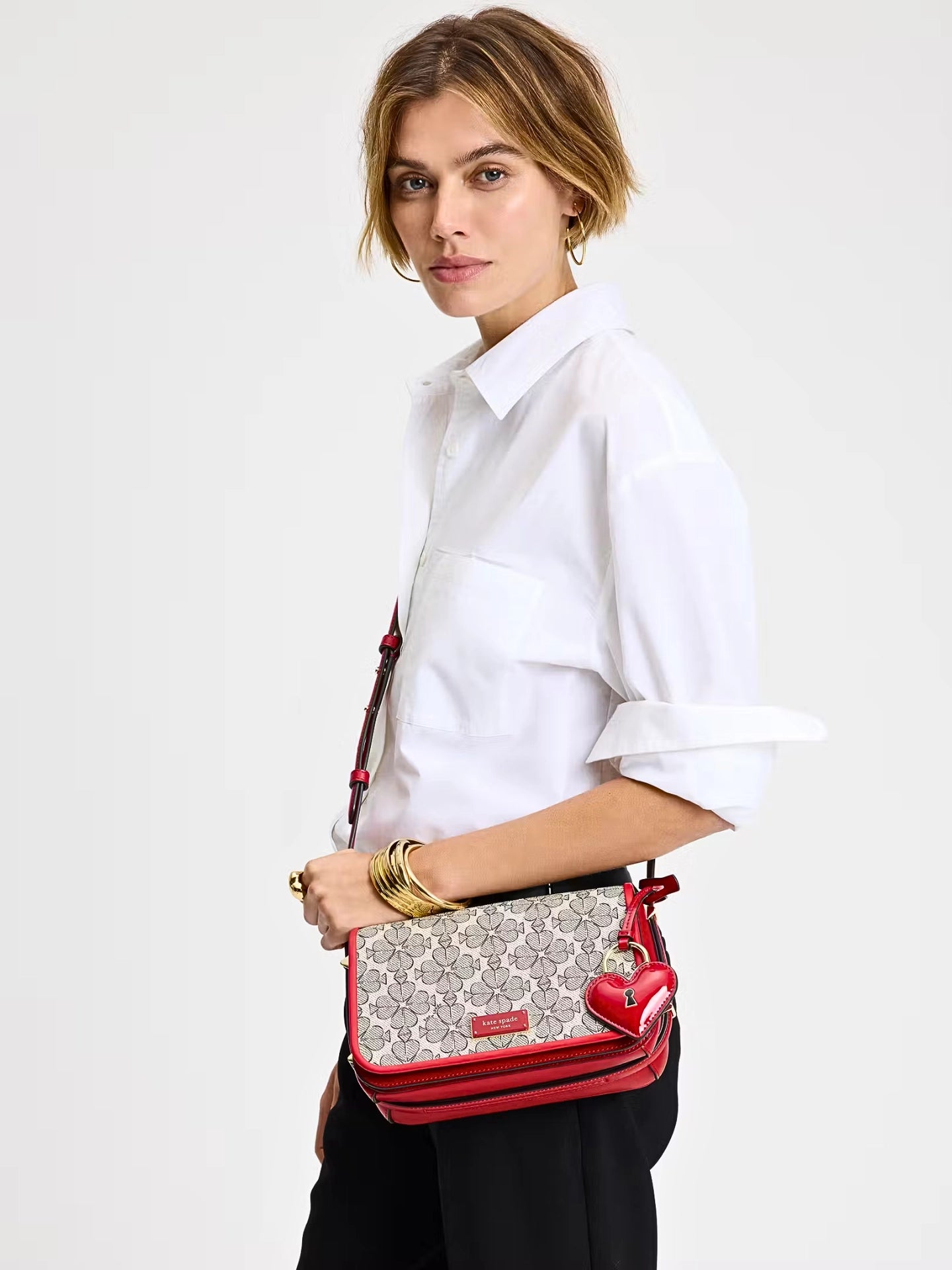 on-model-Kate-Spade-Liv-Spade-Flower-Coated-Canvas-Small-Flap-Crossbody-Cherry-Rouge-Multi