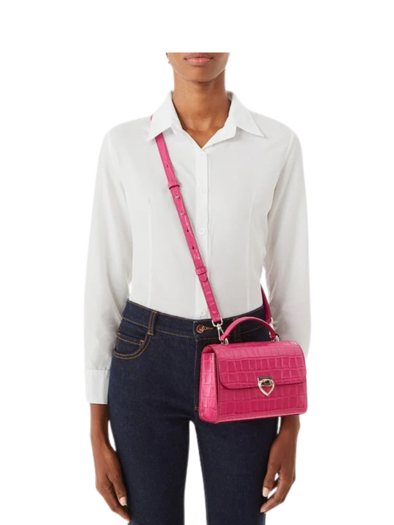 on-model-Kate-Spade-Lovitt-Croc-Embossed-Small-Top-Handle-Bag-Festive-Pink