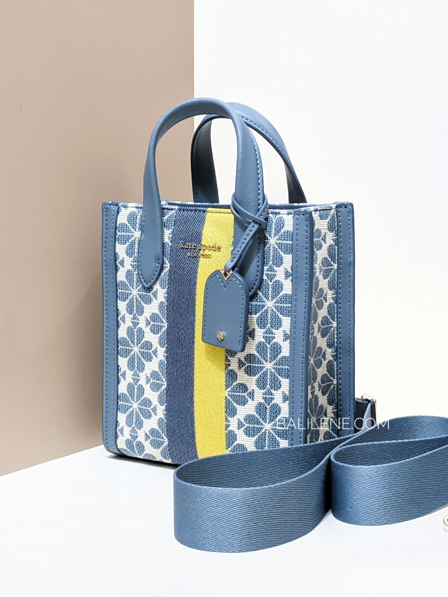 on-model-Kate-Spade-Manhattan-Spade-Flower-Jacquard-Stripe-Mini-Tote-Morning-Sky-Multi