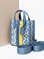 on-model-Kate-Spade-Manhattan-Spade-Flower-Jacquard-Stripe-Mini-Tote-Morning-Sky-Multi