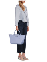 on-model-Longchamp-Le-Pliage-Green-Medium-Top-Handle-Bag-Sky-Blue