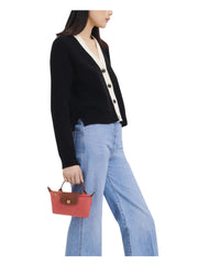on-model-Longchamp-Le-Pliage-Original-Pouch-With-Handle-GrenadineWEBP
