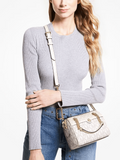 on-model-Michael-Kors-Blaire-Extra-Small-Logo-Duffle-Crossbody-Bag-Vanilla