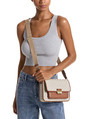 on-model-Michael-Kors-Bradshaw-Medium-Signature-Logo-Messenger-Bag-Vanilla