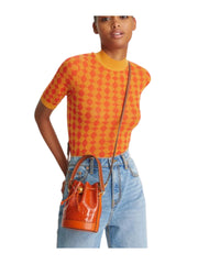on-model-Tory-Burch-T-Monogram-Patent-Embossed-Mini-Bucket-Bag-Spring-SpiceWEBP