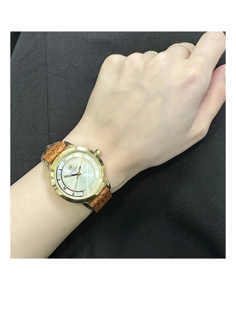 on-model-Toy-Burch-Goldtone-Stainless-Steel-_-Monogram-Leather-Strap-WatchWEBP