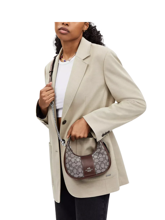 on-model-crossbody-Coach-Carmen-Mini-Crossbody-In-Signature-Jacquard-Oak-Maple