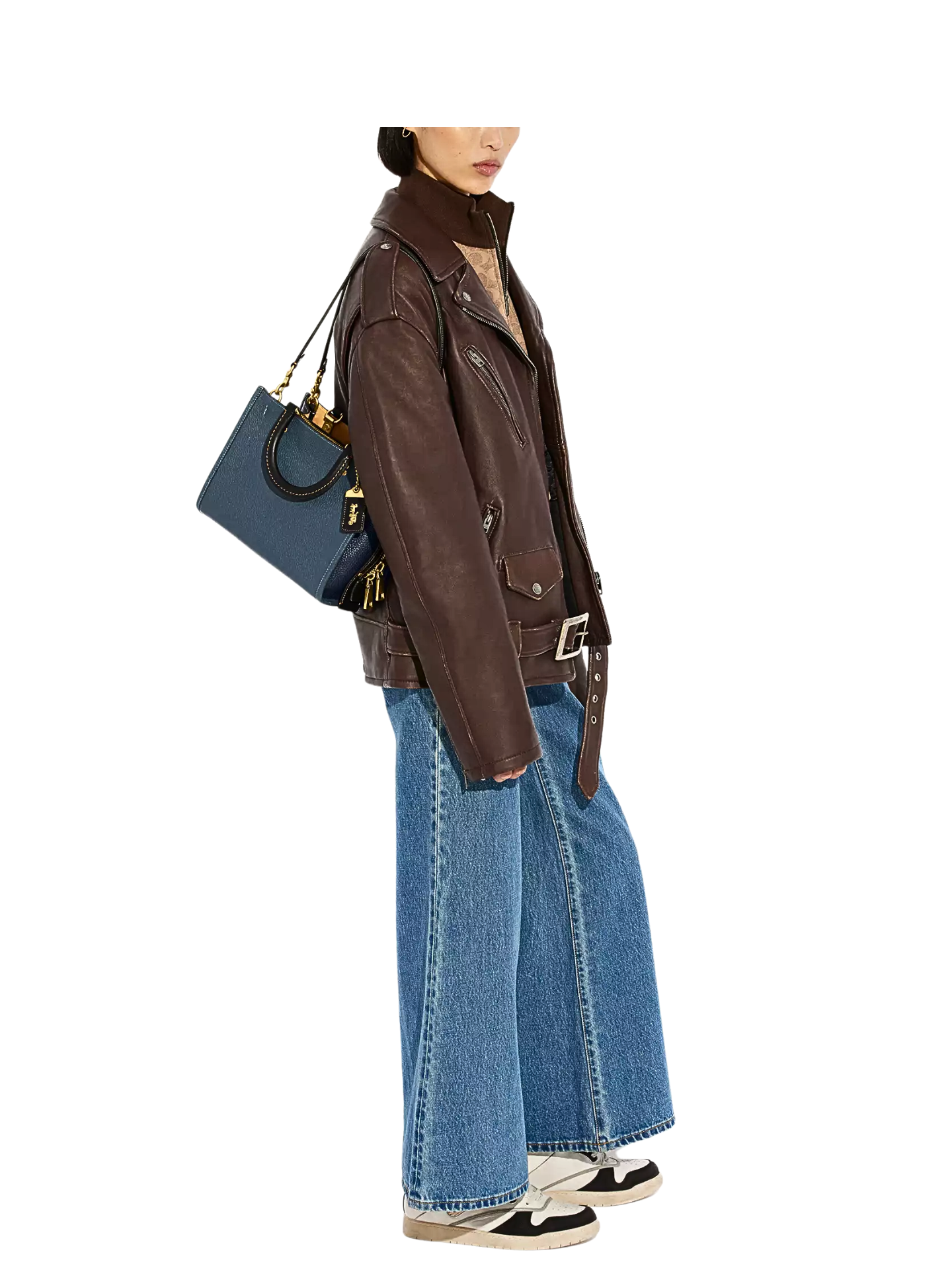on-model-shoulder-Coach-Rogue-Bag-25-In-Regenerative-Leather-Dark-Denim-Multi