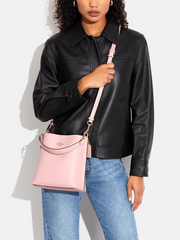 on-model1-Coach-Mollie-Bucket-22-With-Signature-Canvas-Interior-Powder-Pink-Light-Khaki
