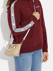 on-model2-Coach-Gallery-Mini-crossbody-signature-canvas-light-khaki-chalk