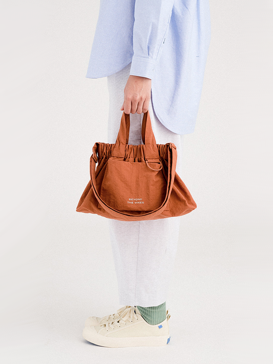 Beyond-The-Vines-XS-Dumpling-Bag-Terracotta-Balilene-onmodel