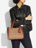 Coach-C3889-Tyler-Carryall-28-In-Signature-Canvas-Tan-Rust-Balilene-onmodel