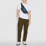 Coach-F72956-Disney-X-Terrain-Belt-Bag-With-Snow-White-And-The-Seven-Dwarfs-Eyes-Print-Black-Multi-Balilene-on-model