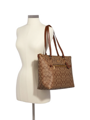    Coach-F79609-Gallery-Tote-In-Signature-Canvas-Saddle-Balilene-onmodel