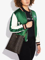 Coach-Mollie-Bucket-Bag-In-Signature-Canvas-Brown-Black-Balilene-onmodel