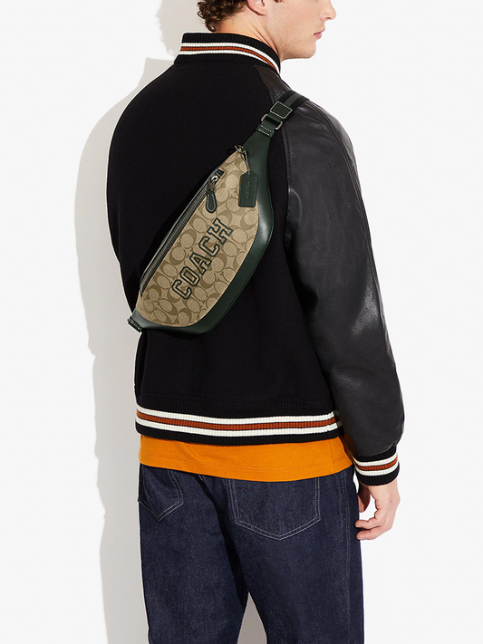    Coach-Warren-Belt-Bag-In-Signature-Canvas-With-Varsity-Motif-Khaki-Amazon-Green-Balilene-onmodel